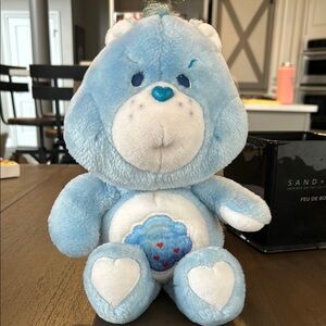 Blue and White Stuffed Animal Plush Toy with Cuddly Body and Belly Badge